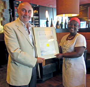 Rhoda receiving certificate from Paul Lohnes